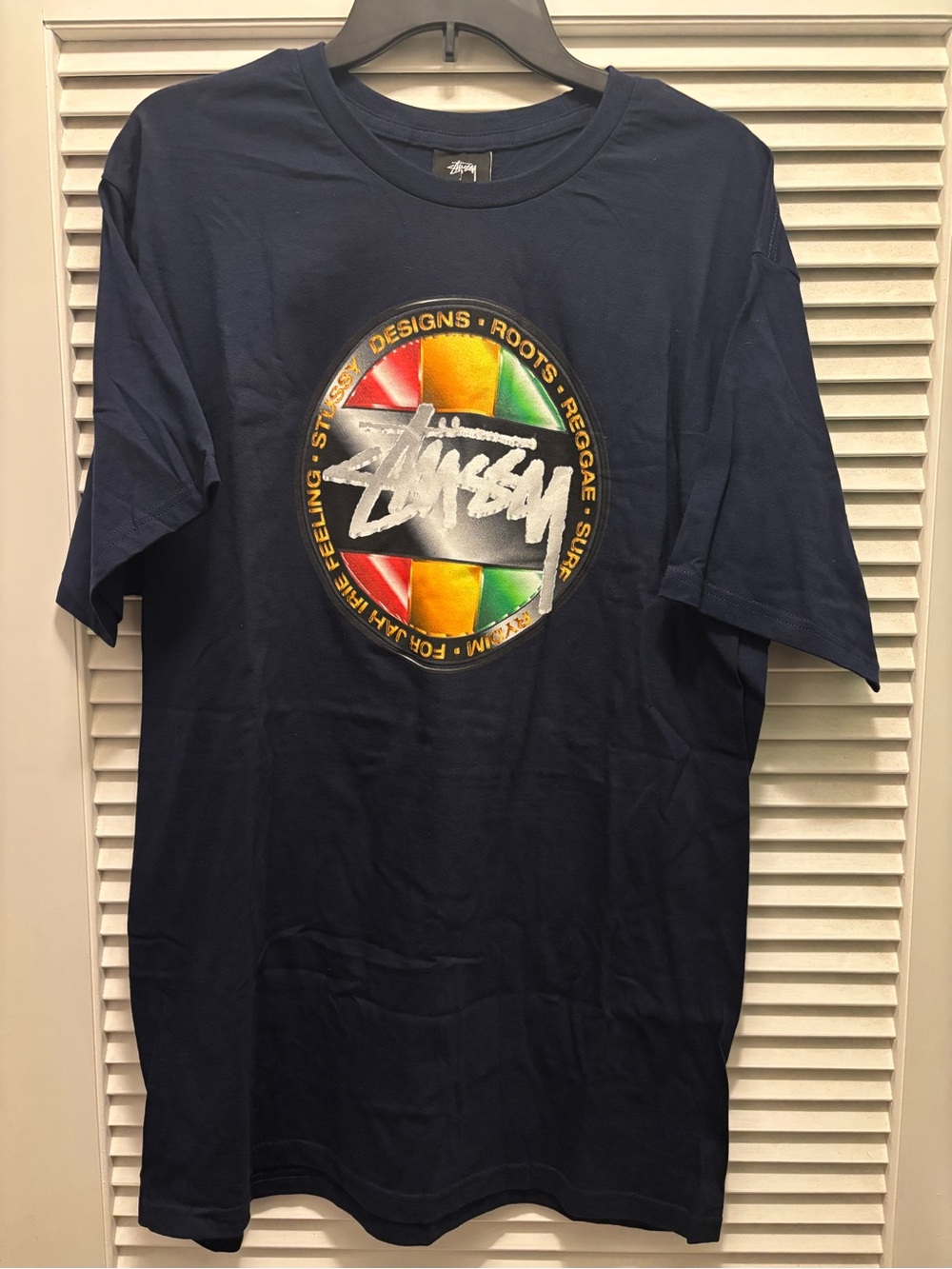 Stussy Navy Short Sleeve T-Shirt with Red Yellow Green Logo